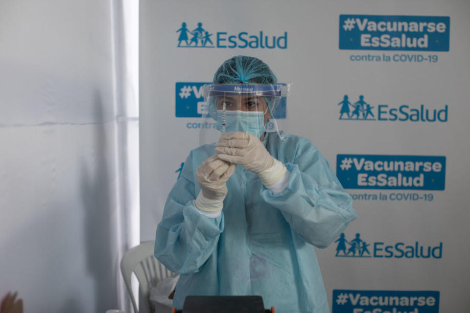 A healthcare worker prepares a dose of the Sinopharm Group Co. Covid-19 vaccine.