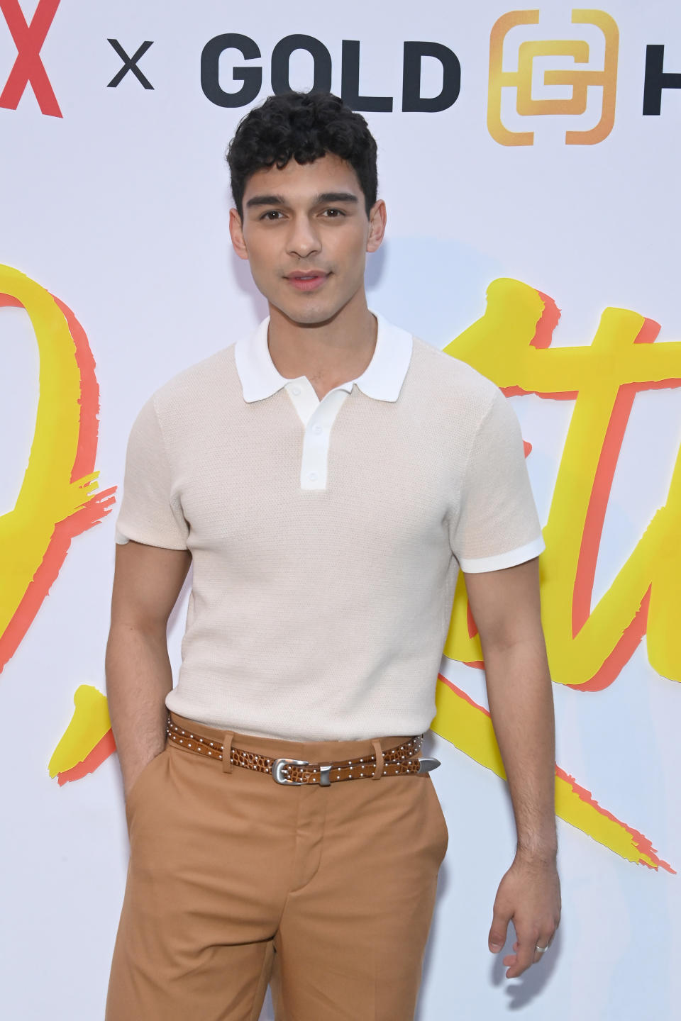 Anthony Keyvan poses for photographers at a red carpet event