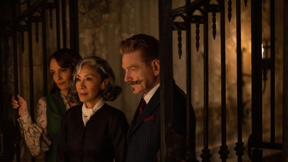 l r tina fey as ariadne oliver, michelle yeoh as mrs reynolds, and kenneth branagh as hercule poirot in 20th century studios' a haunting in venice photo by rob youngson 2023 20th century studios all rights reserved