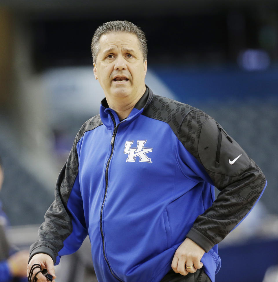 Kentucky head coach John Calipari runs a drill during practice for an NCAA Final Four tournament college basketball semifinal game Friday, April 4, 2014, in Dallas. Kentucky plays Wisconsin on Saturday, April 5, 2014. (AP Photo/David J. Phillip)