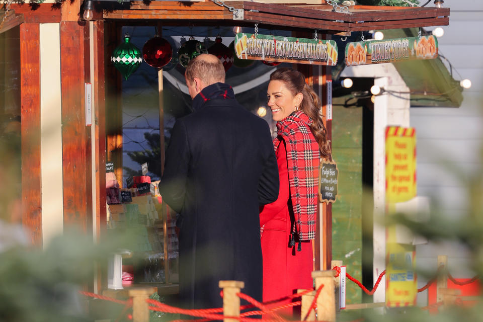 CARDIFF, WALES - DECEMBER 08: Prince William, Duke of Cambridge and Catherine, Duchess of Cambridge attend a 'Toast Your Own Marshmallow' stall during a visit to Cardiff Castle on December 08, 2020 in Cardiff, Wales. The Duke and Duchess are undertaking a short tour of the UK ahead of the Christmas holidays to pay tribute to the inspiring work of individuals, organizations and initiatives across the country that have gone above and beyond to support their local communities this year. (Photo by Chris Jackson/Getty Images)