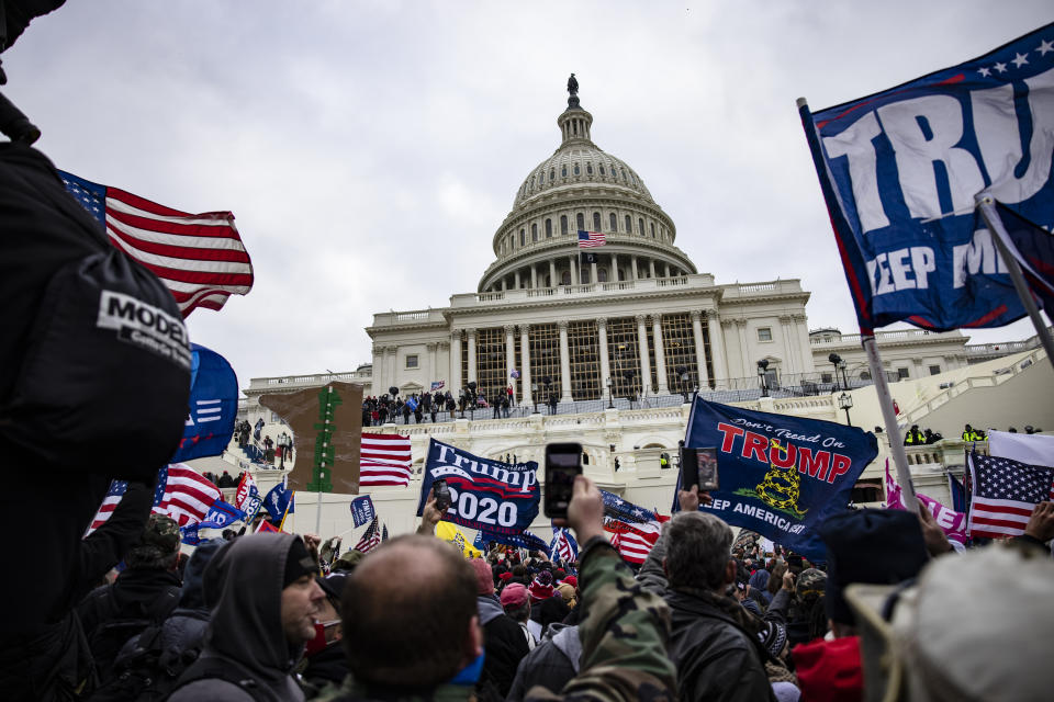 Rioters storm the U.S. Capitol following a rally with then-President Donald Trump on Jan. 6. (Samuel Corum/Getty Images)