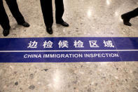 A sign reading "China Immigration Inspection" is displayed on the ground in the Mainland Port Area at West Kowloon Station, which houses the terminal for the Guangzhou-Shenzhen-Hong Kong Express Rail Link (XRL), developed by MTR Corp., in Hong Kong, China, September 22, 2018. Giulia Marchi/Pool via REUTERS
