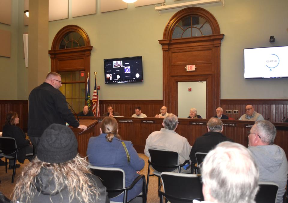 Bob Behnke, Adrian city commissioner, stands at the podium and addresses the Adrian planning commission Tuesday evening, Feb. 6, 2024, during a public hearing regarding proposed changes to Adrian’s accessory parking/storage ordinance. The planning commission was proposing a handful of changes to the language governing where residents can park trailers and similar recreational vehicles on their property. Behnke was one of more than 10 residents to address the commission at the public hearing.