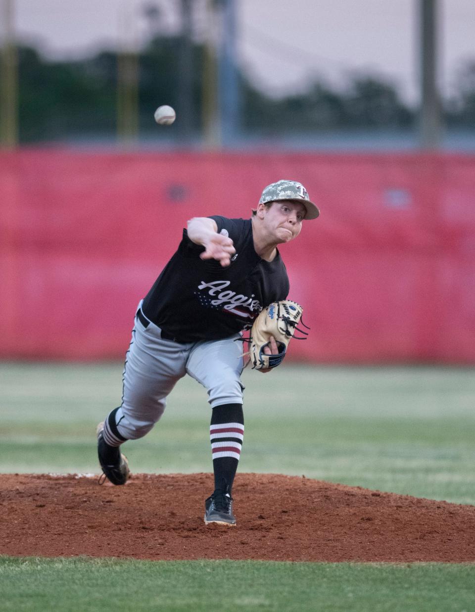 Josiah Glodfelter (6) pitches during the Tate vs Pace baseball game at Pace High School on Friday, April 15, 2022.