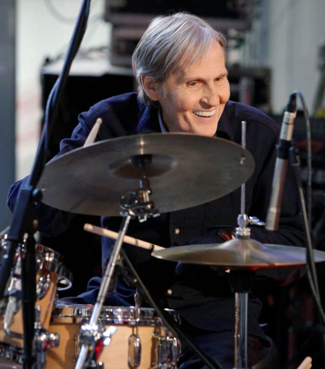 FILE – In this Oct. 9, 2009 file photo, Levon Helm, right, performs with his band on the “Imus in the Morning” program on the Fox Business channel, in New York. The influential Grammy-winning singer and drummer for The Band died of throat cancer earlier this year at age 71. John Mayer, Gregg Allman, Dierks Bentley and several other musicians are getting together to pay tribute to the late Levon Helm. The Love for Levon benefit concert will be held Oct. 3 at the Izod Center in East Rutherford, N.J. (AP Photo/Richard Drew, File)