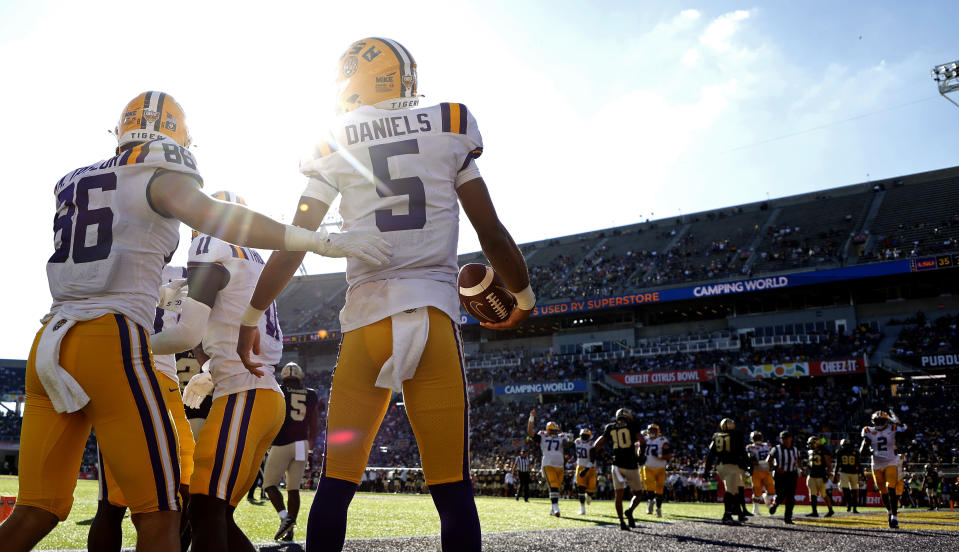 Jayden Daniels celebrates a touchdown during a game on Jan. 2. (Mike Ehrmann/Getty Images)