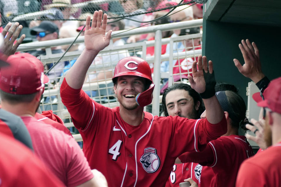 Cincinnati Reds' Wil Myers smiles as he celebrates his home run against the Los Angeles Angels during the fourth inning of a spring training baseball game Monday, March 20, 2023, in Goodyear, Ariz. (AP Photo/Ross D. Franklin)