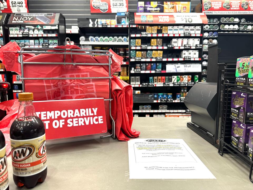 A tobacco and vape section in Columbus includes a sign telling people they must shop outside the city to purchase flavored tobacco products. Those items were prohibited in the city beginning Jan. 1.