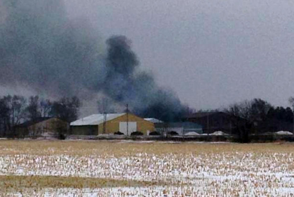 In this image from video provided by KIMT-TV smoke rises from a fire in Northwood, Iowa, Thursday, Feb. 20, 2014. Authorities say an evacuation order is in place for Northwood due to a fire at a fertilizer plant at Northwood Municipal Airport. No one is reported injured. (AP Photo/KIMT-TV, Levi Ismail)