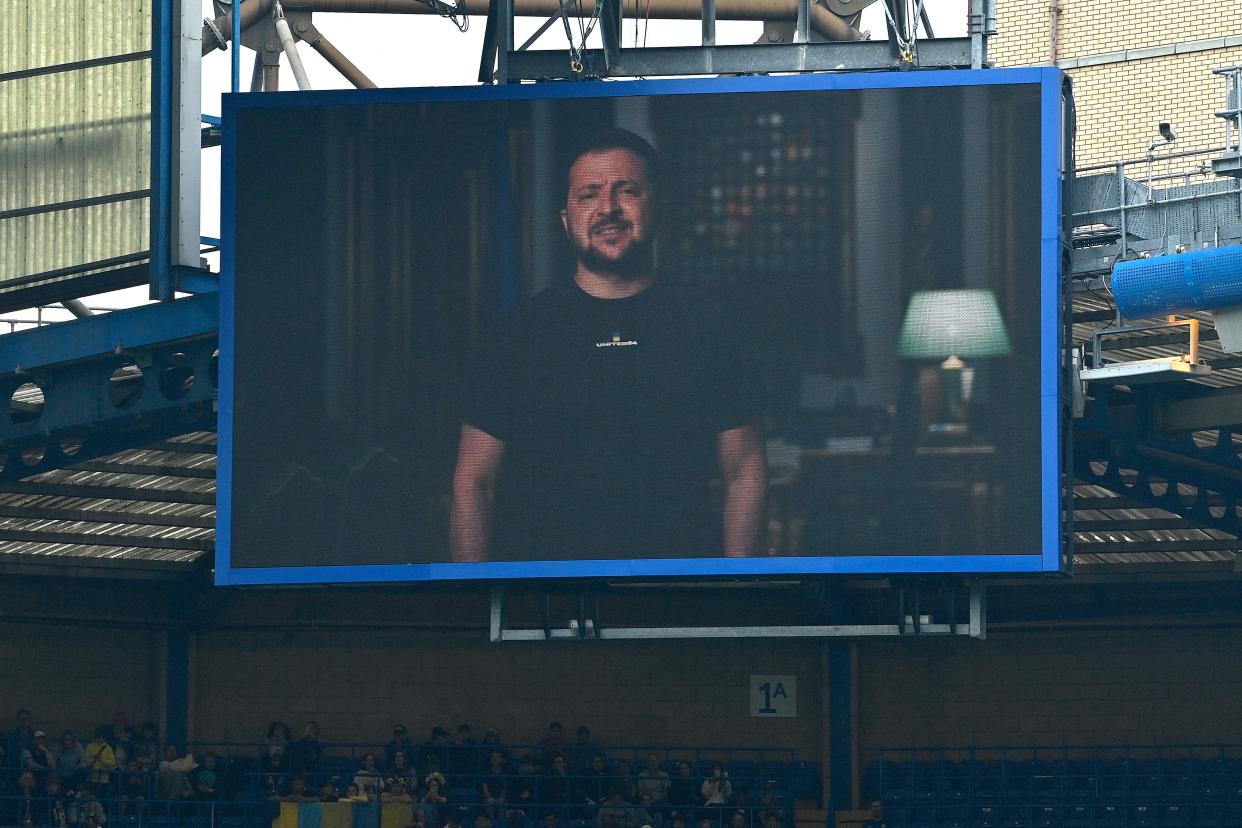 Ukraine's President Volodymyr Zelensky addresses the players ands the crowd from a giant screen ahead of the Game4Ukraine (AFP via Getty Images)