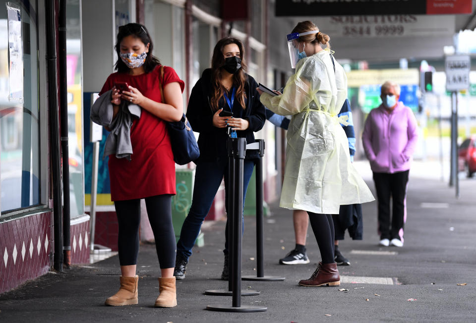 People line up for a Covid-19 test in Brisbane on Tuesday. Source: AAP