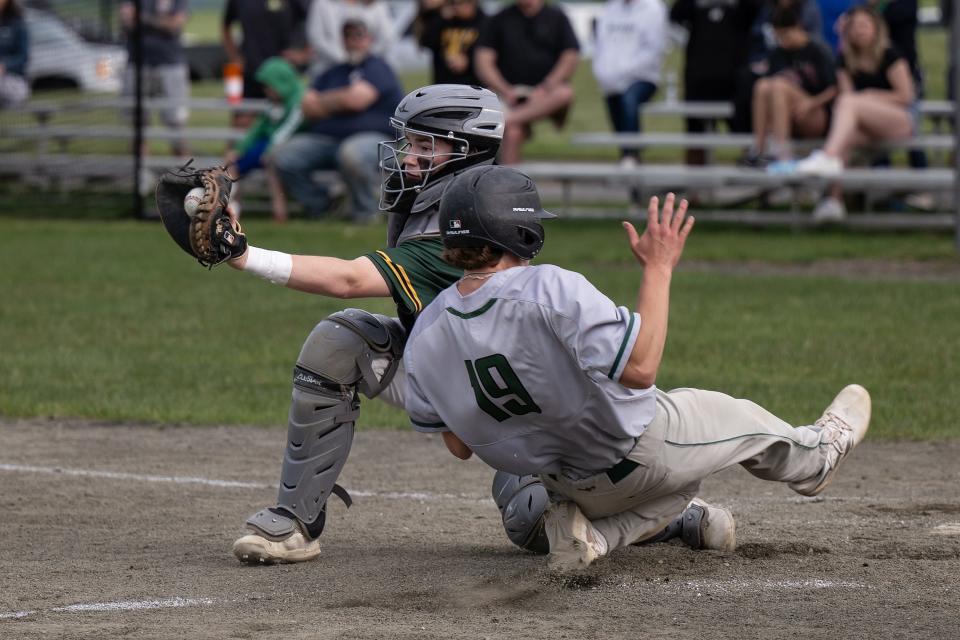 Wachusett's Brayden Allaire slides home just before the throw to Tantasqua's Ethan LaPlante to tie the game, 1-1.