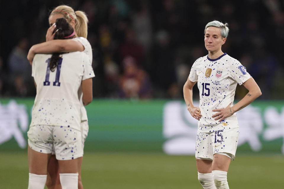 Megan Rapinoe, right, and her teammates following their loss to Sweden at the Women's World Cup in Melbourne, Australia, on Aug. 6, 2023.  (Scott Barbour / AP)
