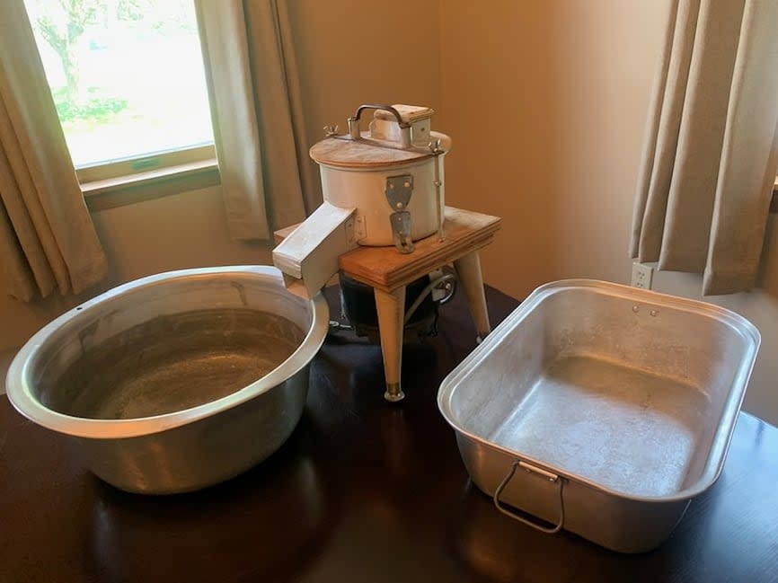 The device in the centre is an electric potato grater, created by Michelle Trottier's dad. It was designed to speed up the process for making rappie pie. 