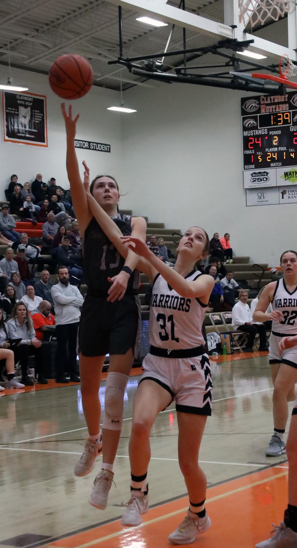 John Glenn's Riley Zamensky (13) attempts a shot during the Division II District Semifinal game against Carrolton. Zamensky was tabbed the Division II Girls Co-Player of the Year in the East District by district members of the Ohio Prep Sportswriters Association.