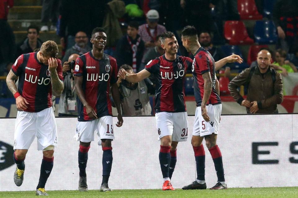 Bologna's Blerim Dzemaili, second right, celebrates with teammates after scoring during the Italian Serie A soccer match between Bologna FC and SSC Napoli at the Renato Dall'Ara stadium in Bologna, Italy, Saturday, May 25, 2019. (Giorgio Benvenuti/ANSA via AP