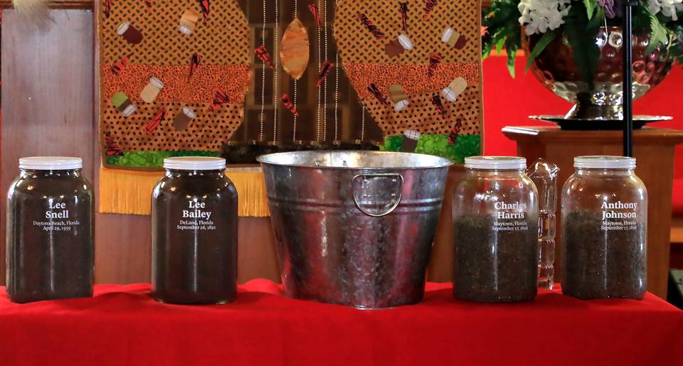 Jars of soil, collected from the approximate site of where Black men were extrajudicially lynched in Volusia County, sit on a table inside Macedonia Missionary Baptist Church in Osteen on Saturday, Sept. 17.