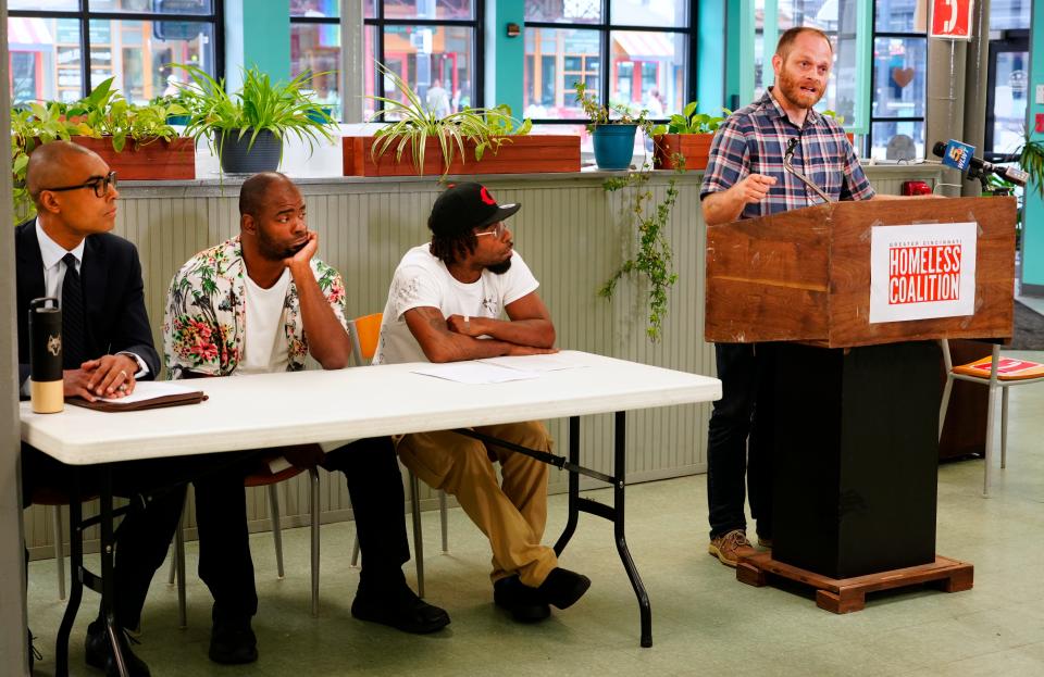 The city still needs more affordable housing to prevent homelessness, said Josh Spring, executive director of the Great Cincinnati Homeless Coalition.  Joining him at a Tuesday press conference at Our Daily Bread in Over-the-Rhine were Bennett Allen, an attorney for the coalition (left);  Allen Howard, who lived in one of the tents;  and Leon “Bison” Evans, 38, who was named mayor of Tent City at the time.