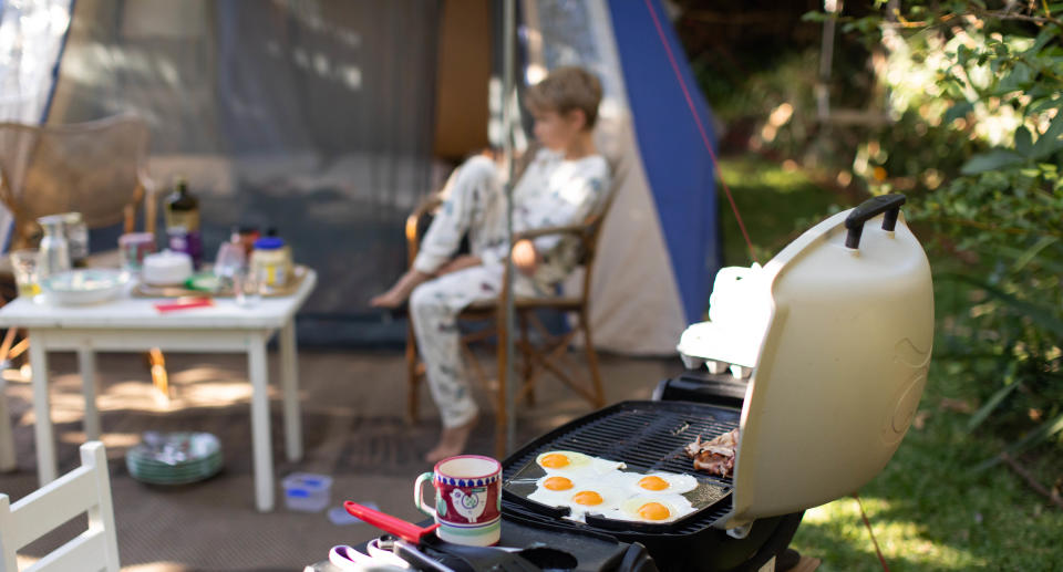 Breakfast being cooked on a BBQ at a campground. Source: Getty Images 