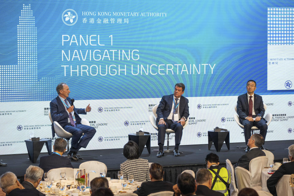 Chairman and CEO of Morgan Stanley James Gorman, left, speaks during the Global Financial Leaders' Investment Summit in Hong Kong, Wednesday, Nov. 2, 2022. Chinese regulators downplayed China's real estate slump and slowing economic growth while Hong Kong's top leader pitched Hong Kong as a unique link to the rest of China at a high-profile investment summit Wednesday. (AP Photo/Bertha Wang)