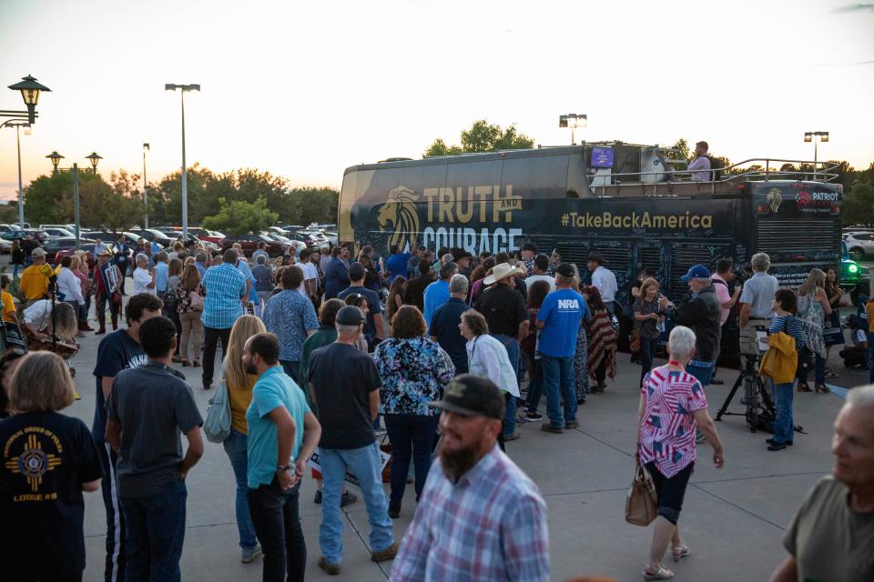 Attendees wait in line to take a photo with Sen. Ted Cruz,  R-Texas, and U.S. Rep. Yvette Herrell, R-N.M., during the Truth and Courage Rally on Monday, Oct. 3, 2022, at the New Mexico Farm and Ranch Heritage Museum.