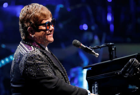 FILE PHOTO: Elton John performs during his "Farewell Yellow Brick Road" final tour at the Staples Center in Los Angeles, California, U.S. January 22, 2019. REUTERS/Mario Anzuoni