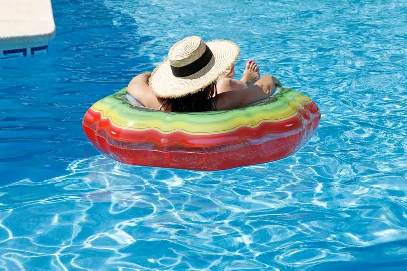 Photo shows a woman in a pool