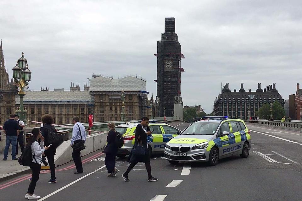 Police officers cordon off Westminster Bridge, leading to Parliament Square, after Salih Khater rammed his car into barriers at the Houses of Parliament on August 14, 2018 (AFP/Getty Images)
