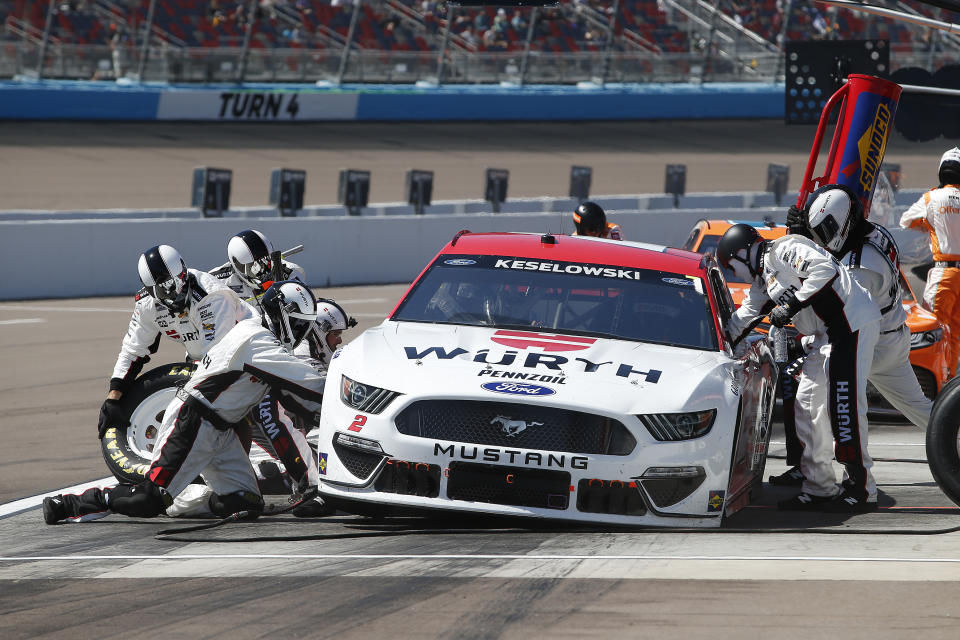 Brad Keselowski makes a pit stop for fuel and tires during a NASCAR Cup Series auto race at Phoenix Raceway, Sunday, March 14, 2021, in Avondale, Ariz. (AP Photo/Ralph Freso)