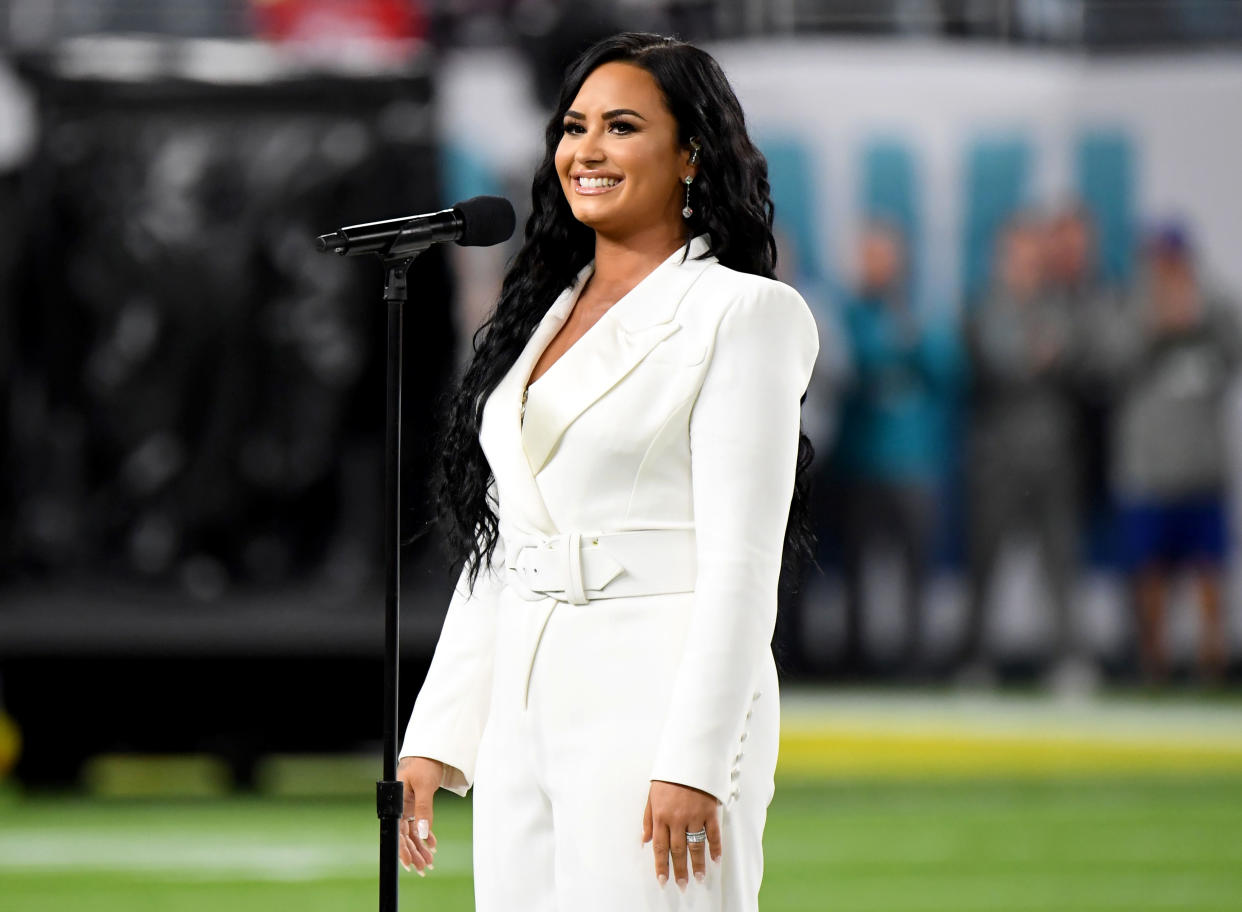 Demi Lovato, who got engaged this week, reflects on her overdose two years later and says she's "free of my demons." 