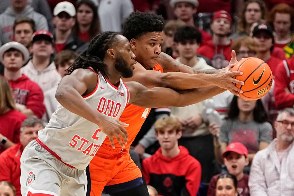 Feb 1, 2024; Columbus, Ohio, USA; Ohio State Buckeyes guard Bruce Thornton (2) fights for a loose ball with Illinois Fighting Illini guard Justin Harmon (4) during the second half of the NCAA men’s basketball game at Value City Arena. Ohio State lost 87-75.