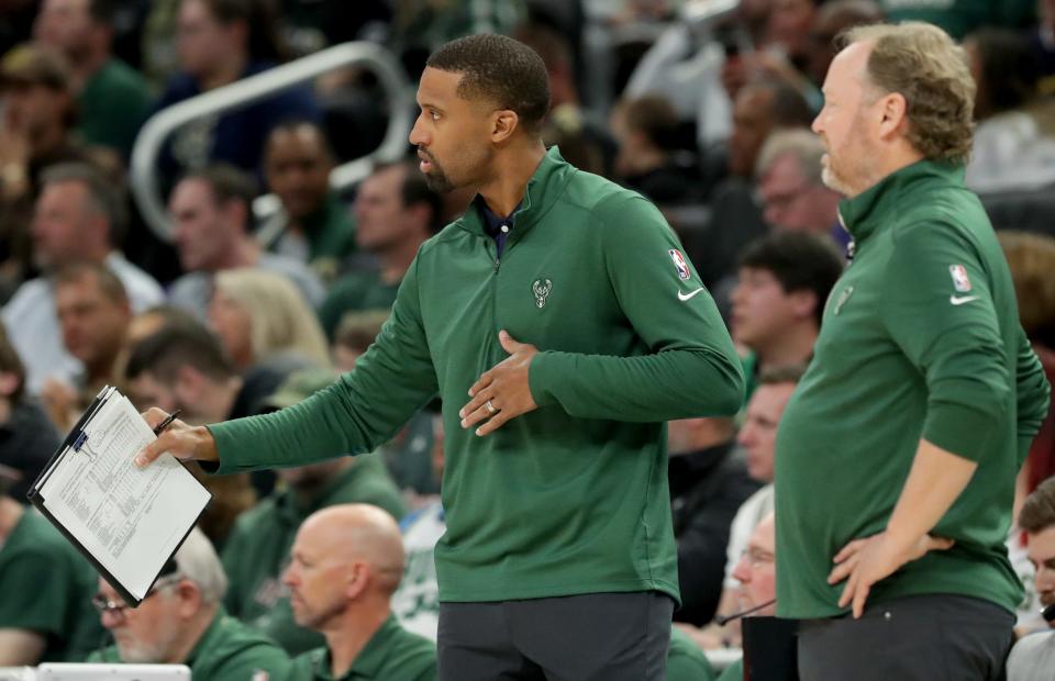 Milwaukee Bucks assistant coach Charles Lee, left, is shown with head coach Mike Budenholzer during the second half of their game Sunday, April 3, 2022 at Fiserv Forum in Milwaukee, Wis. The Dallas Mavericks beat the Milwaukee Bucks 118-112.