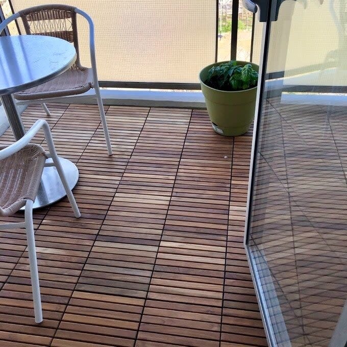 the wood floor tiles installed on a deck
