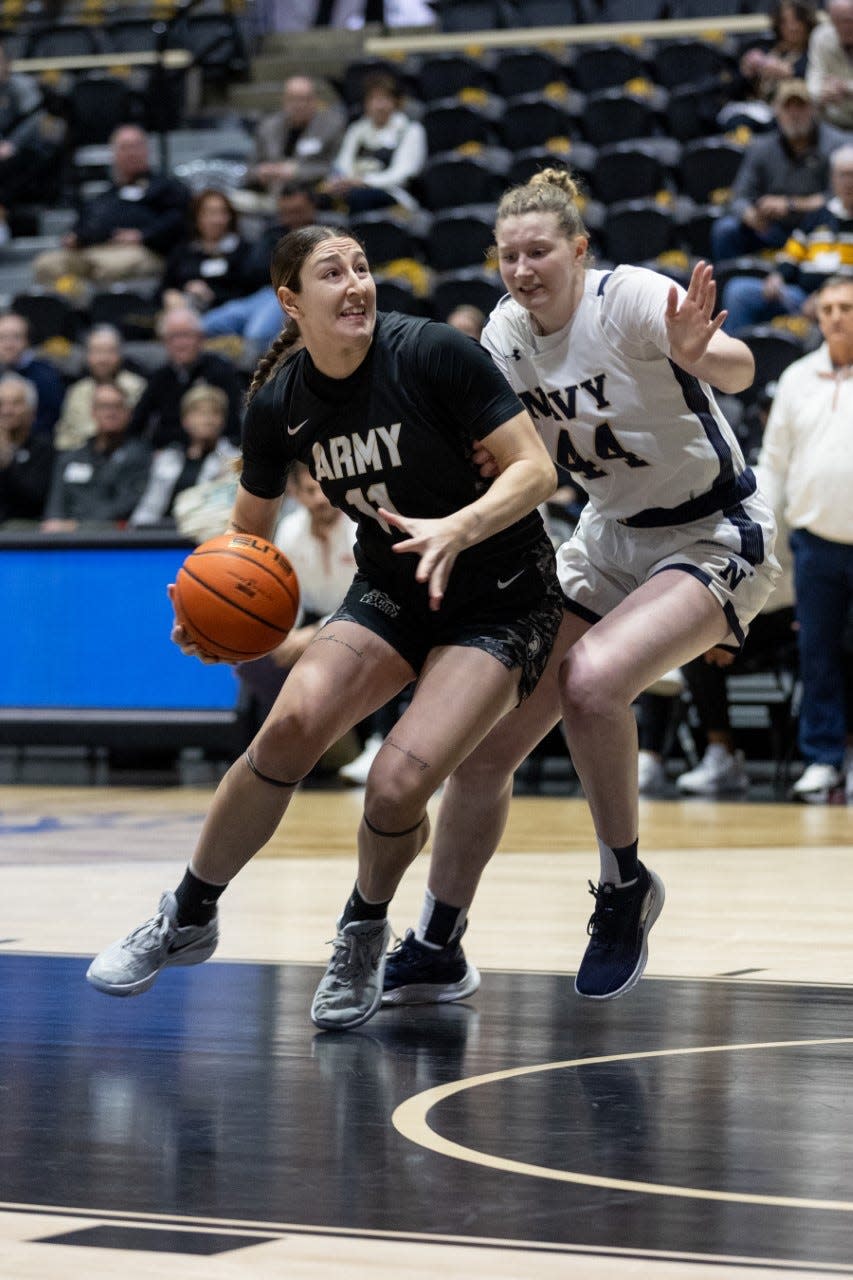 Army's Sabria Hunter drives to the basket on Saturday against Navy. ALLYSE PULLIAM/For the Times Herald-Record