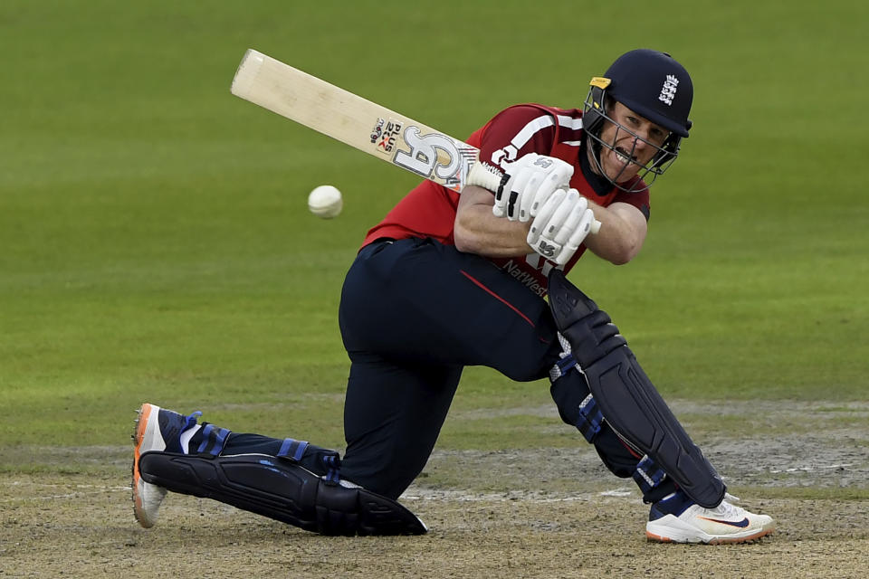 England's captain Eoin Morgan plays a shot during the first Twenty20 cricket match between England and Pakistan, at Old Trafford in Manchester, England, Friday, Aug. 28, 2020. (Mike Hewitt/Pool via AP)