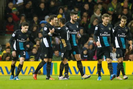Arsenal's Mesut Ozil celebrates scoring their first goal with Alexis Sanchez Action Images via Reuters / Andrew Boyers