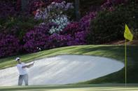 Webb Simpson of the U.S. chips to the 13th green from a sand trap during first round play of the 2018 Masters golf tournament at the Augusta National Golf Club in Augusta, Georgia, U.S., April 5, 2018. REUTERS/Mike Segar