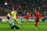 MUNICH, GERMANY - NOVEMBER 22: Franck Ribery (R) of Bayern Muenchen scores his first goal against goalkeeper Diego Lopez (L) of Villareal during the UEFA Champions League group A match between FC Bayern Muenchen and Villareal CF at Allianz Arena on November 22, 2011 in Munich, Germany. (Photo by Alexandra Beier/Bongarts/Getty Images)