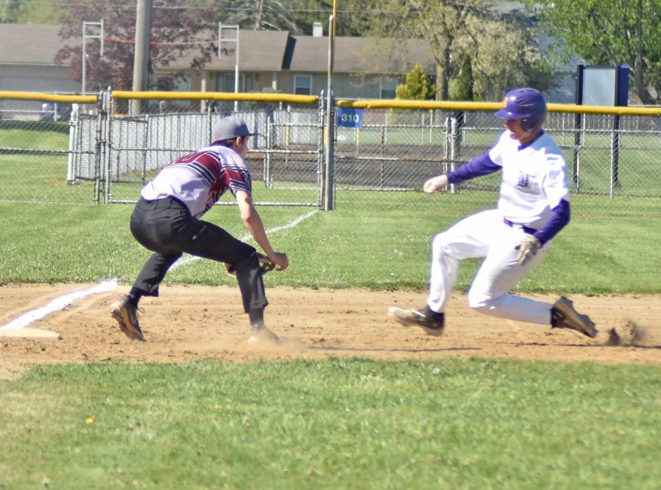 Bronson's Kestin Goodman is thrown out trying to steal third by Union City catcher Tucker Zweng. Rick Austin makes the tag for Union City