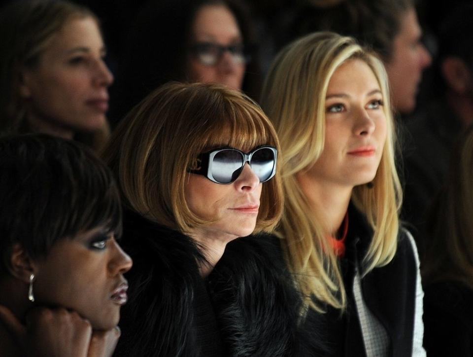 Anna Wintour wearing sunglasses in the audience