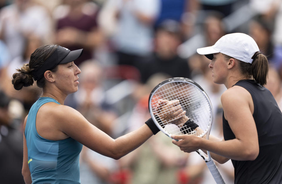 Jessica Pegula of the United States, left, shakes hands with Iga Swiatek of Poland, following the semifinals of the National Bank Open women’s tennis tournament Saturday, Aug. 12, 2023, in Montreal. (Christinne Muschi/The Canadian Press via AP)