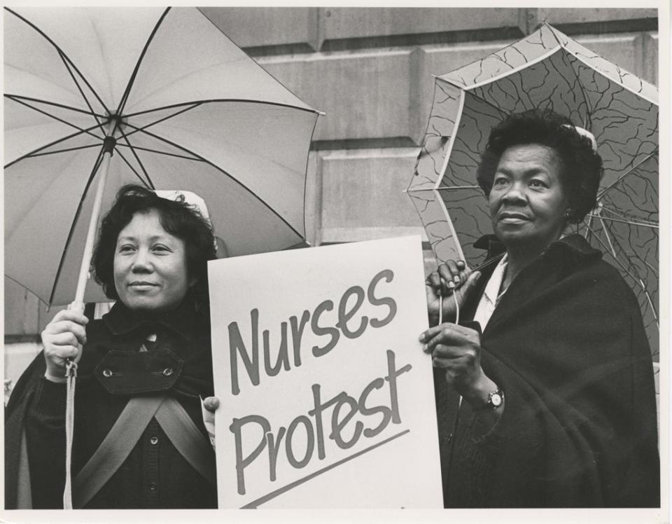 Nurses picketing outside Bart’s Hospital in London, striking over low pay, unfair salary structures and untenable working conditions, in February 1988 (Maggie Murray)