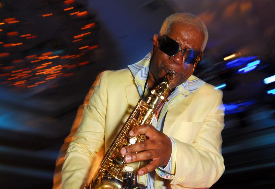 Dennis Thomas playing the saxophone