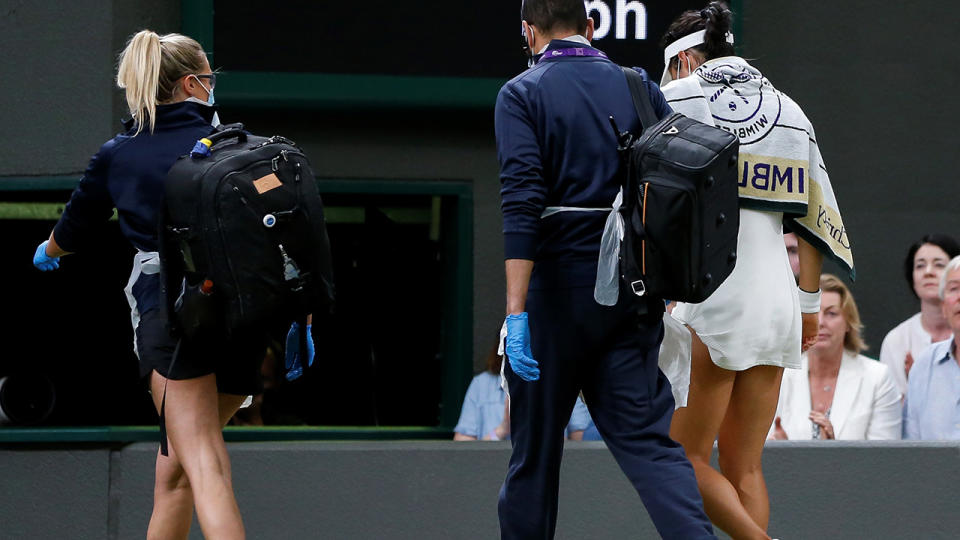 Emma Raducanu, pictured here leaving the court for a medical timeout at Wimbledon.