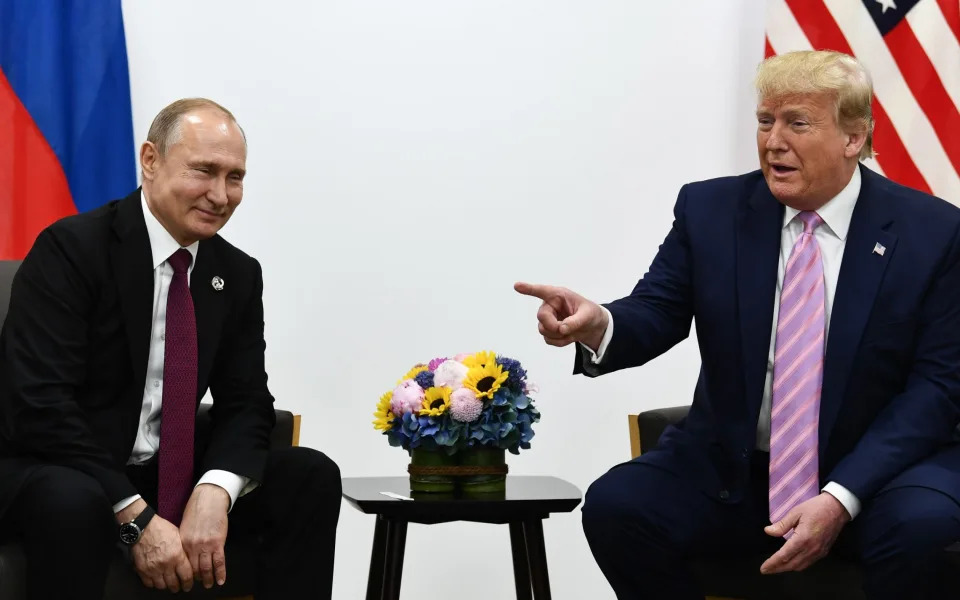 US President Donald Trump (R) attends a meeting with Russia's President Vladimir Putin during the G20 summit in Osaka on June 28, 2019