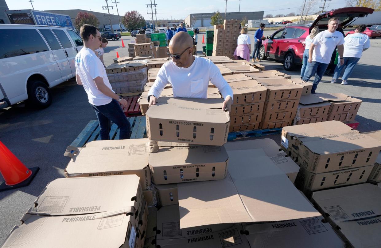 Marty Tiggs with Zurn Elkay Water Solutions, out of Milwaukee, carries a box of turkeys to a van at the Hunger Task Force on West Electric Avenue in West Milwaukee , on Thursday, Nov. 10, 2022. The Hunger Task Force distributed more than 1,000 turkeys to its emergency food network from its headquarters in West Milwaukee in time for Thanksgiving. More than 70 local food pantry coordinators picked up the turkeys, free of charge, and distributed them to local families facing the greatest need this holiday season.