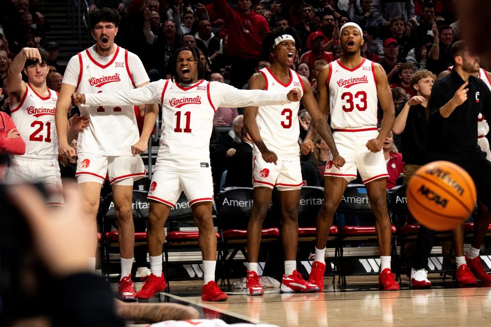 Cincinnati Bearcats bench celebrates after Cincinnati Bearcats guard Day Day Thomas (1) draws a foul in the second half of their 69-65 loss to No. 15 Oklahoma Saturday.