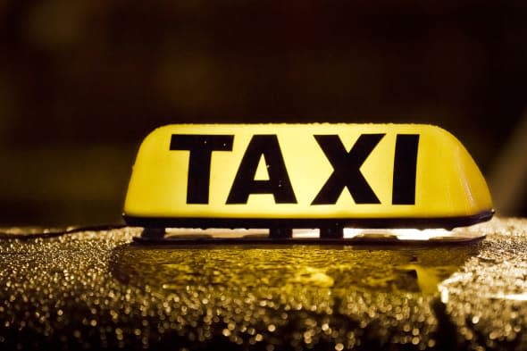 taxi sign in rainy day