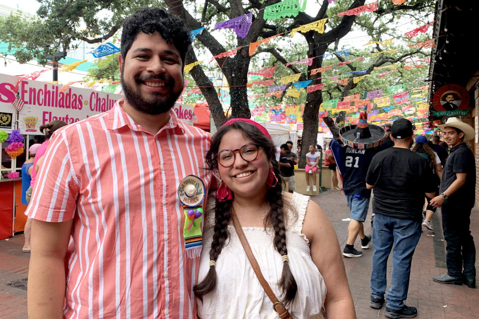 David Ramirez, 23, and Jessica Guzman, 23, made the trip back home to San Antonio from Houston to partake in the smaller Fiesta celebration that was canceled last year because of Covid-19. (Suzanne Gamboa / NBC News)